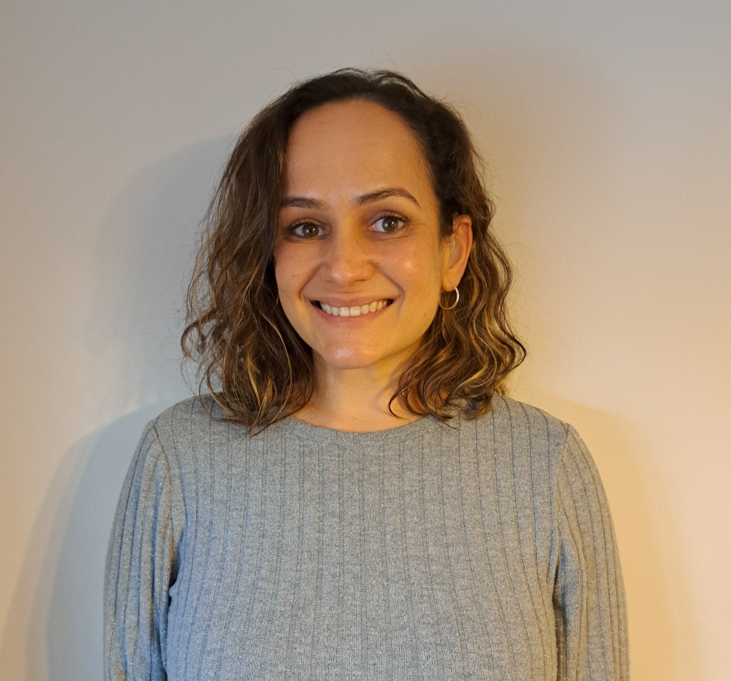 Natalie, profoundly deaf BSL tutor, smiling warmly.